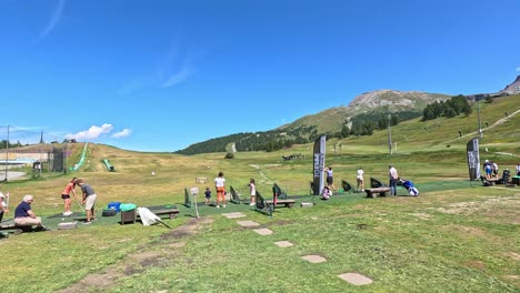 people enjoying a sunny day in the mountains