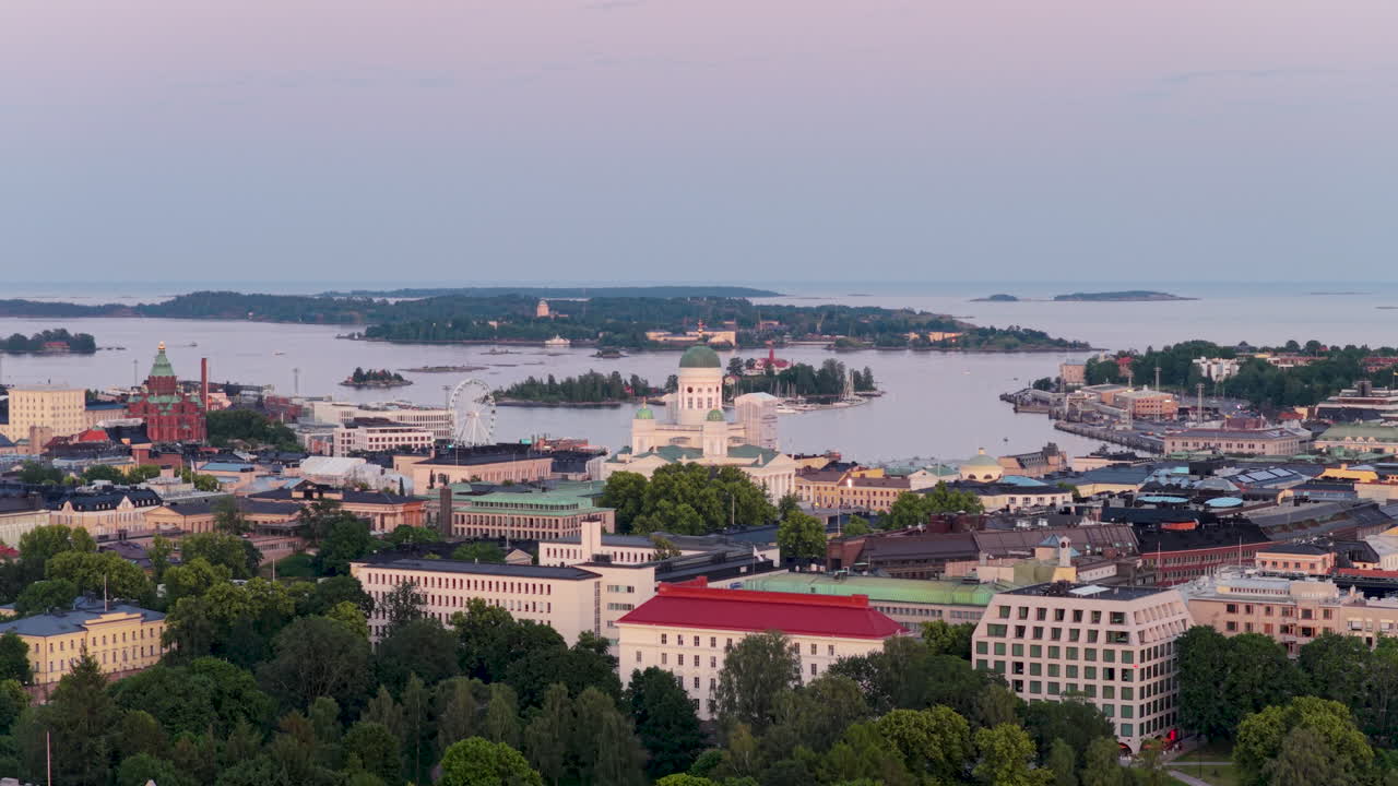 Telephoto drone shot away from the Helsinki cathedral, summer sunrise in Finland