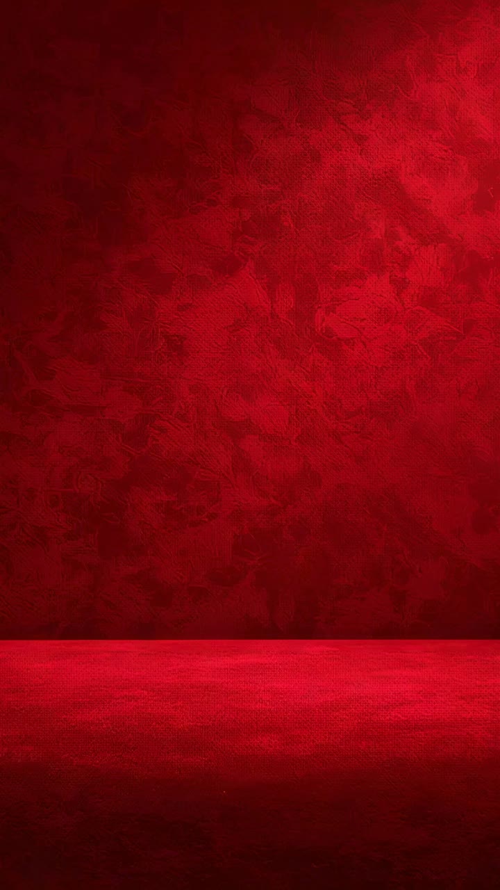 Vertical video: Showing curved dark shadow appearing at frame four on studio red wall and low stage