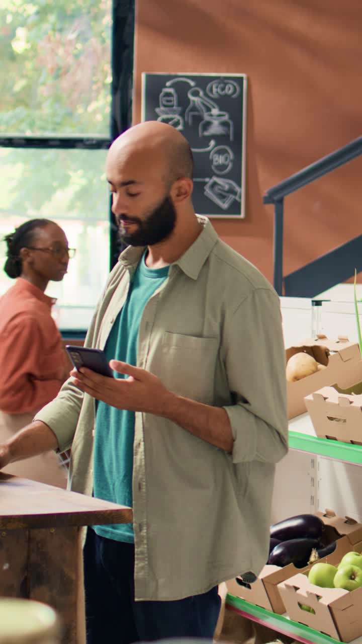 Vertical video Middle eastern adult checks ingredients list