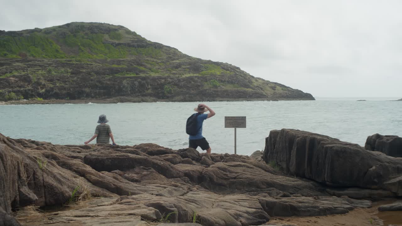 The sign at the northernmost point of Australia, known as Pajinka, or The Tip, in Cape York. A man and his son reach the sign. Clip 2