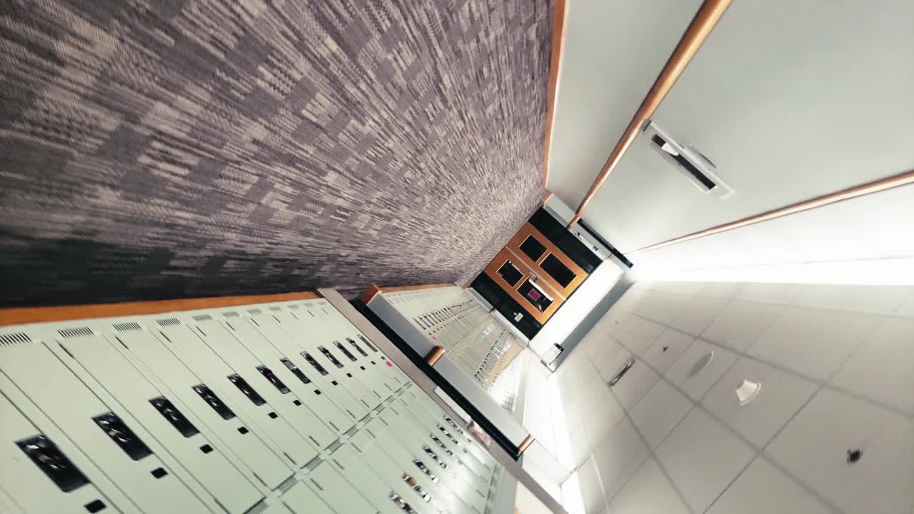 Spiral Vertigo twisted dizzy empty school hallway, with carpeted floors, and fluorescent lighting, lockers, no people in sight, and all class rooms, audioriums completely empty. 1-2