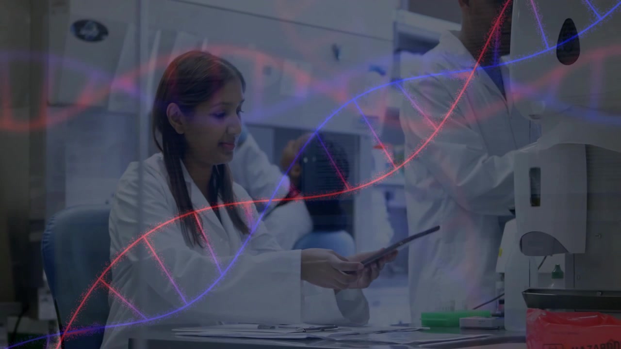 Lab scientist picking tablet scrolling chart analyzing data while colleague loading centrifuge