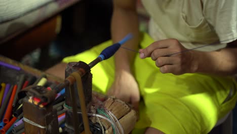 man working with an old machine to make the famous moroccan carpets