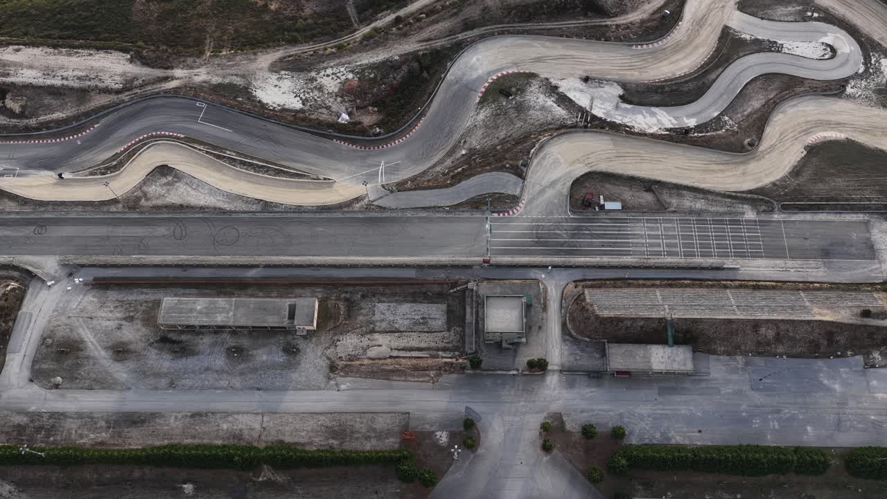 Empty race track with a lot of tire marks on the asphalt