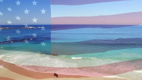 Composición-Digital-De-Ondear-La-Bandera-Estadounidense-Contra-La-Vista-Aérea-De-La-Playa-Y-Las-Olas-Del-Mar