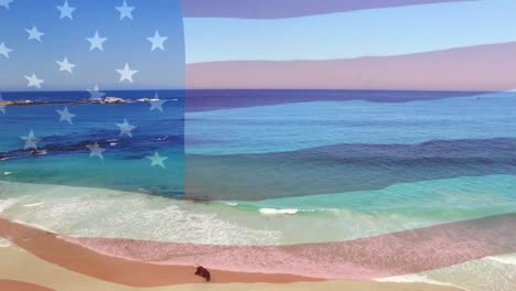 Digitale-Komposition-Der-Schwenkenden-US-Flagge-Vor-Der-Luftaufnahme-Des-Strandes-Und-Der-Meereswellen