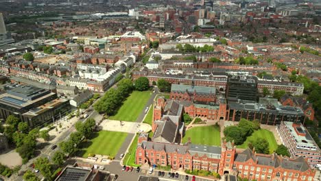 ultra-wide overhead aerial video of queen's university belfast, in northern ireland, uk on a bright and sunny day. produced at 4k resolution, 60fps and with rec709 color.