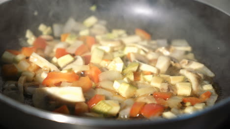 vegetable stir fry in frying pan. close up of frying pan with fried vegetables