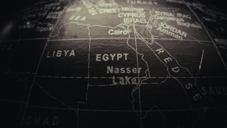 close-up of a world map globe, focusing on north africa and the middle east.