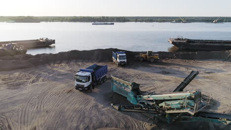 sand loading and transport operations at river port