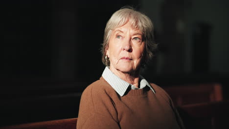 senior woman sitting on a church pew