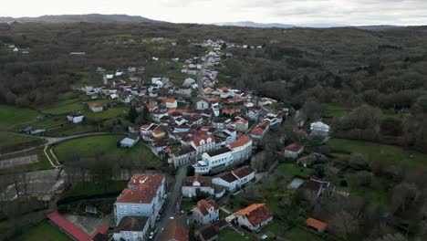 aerial pullback reveals molgas village in countryside of ourense spain