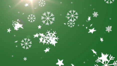 copos de nieve e iconos de estrellas múltiples cayendo contra el punto de luz sobre un fondo verde