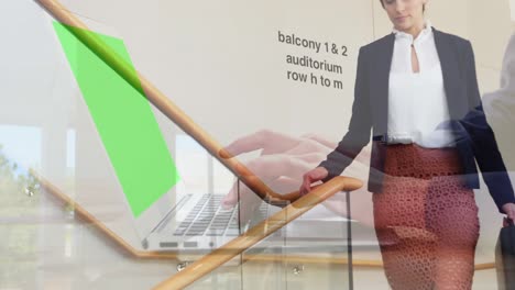 Animation-of-hands-working-on-laptop-with-green-screen-over-businesswoman-on-staircase-at-workplace