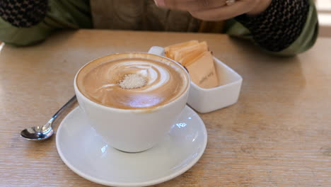 adding raw sugar to latte