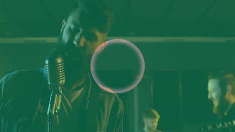 singer and bandmates rehearsing under green light, with animated sound waves for music production