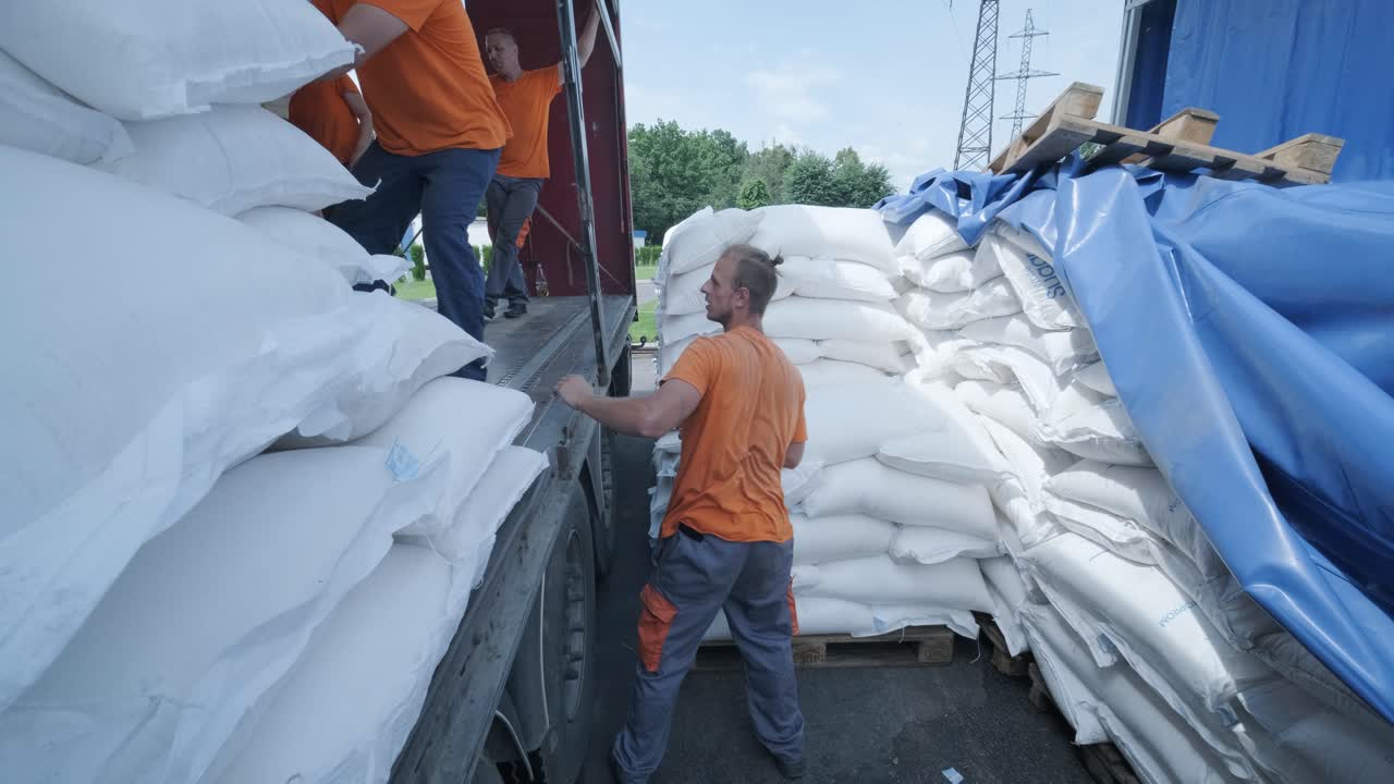 Stacking of sugar bags on truck move to warehouse