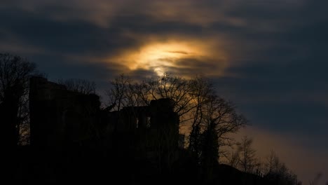 Full-moon-behind-clouds-over-ancient-castle-Timelapse