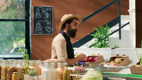 happy man spraying fresh produce