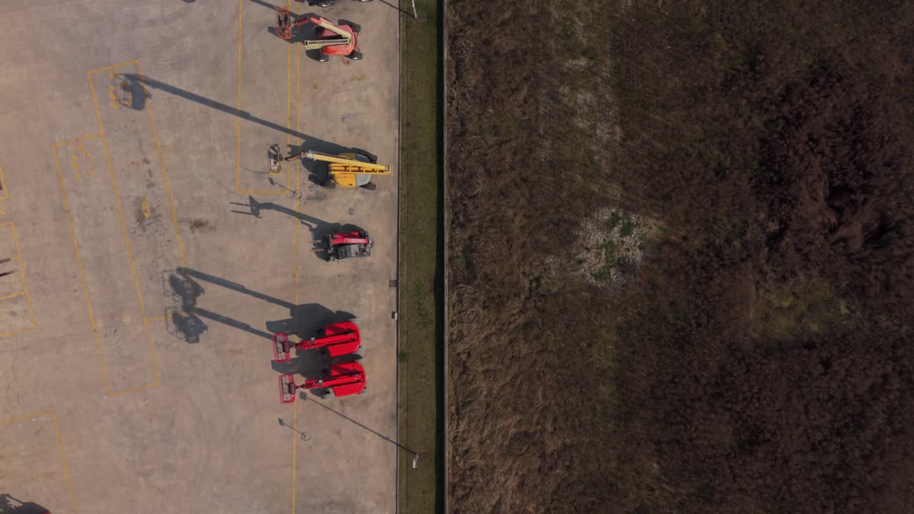Construction Equipment Yard With Lifts And Loaders Aerial View