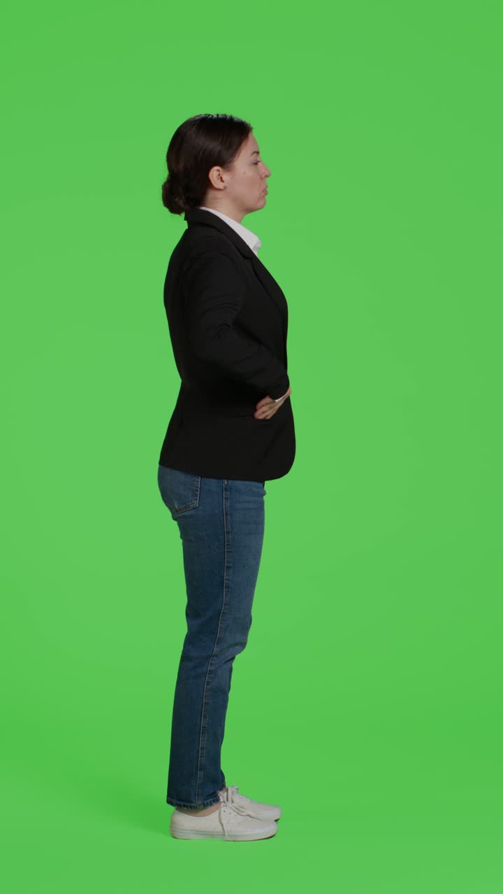 Vertical video: Profile of young businesswoman acting confident wearing suit