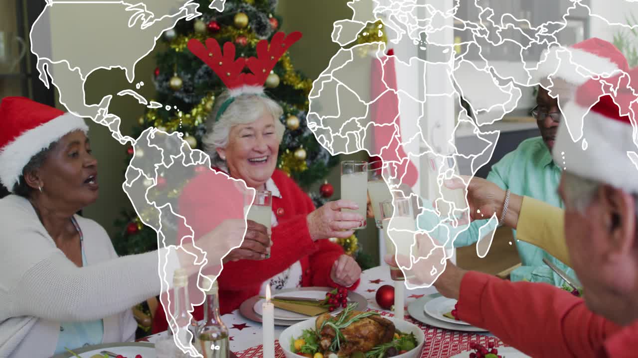 Seniors raising glasses after meal served for holiday toast, world map overlay expanding over group