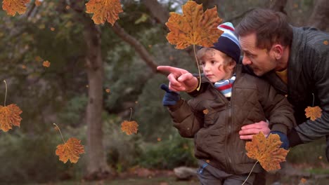 animation of fall leaves falling over happy caucasian father and son in autumn park