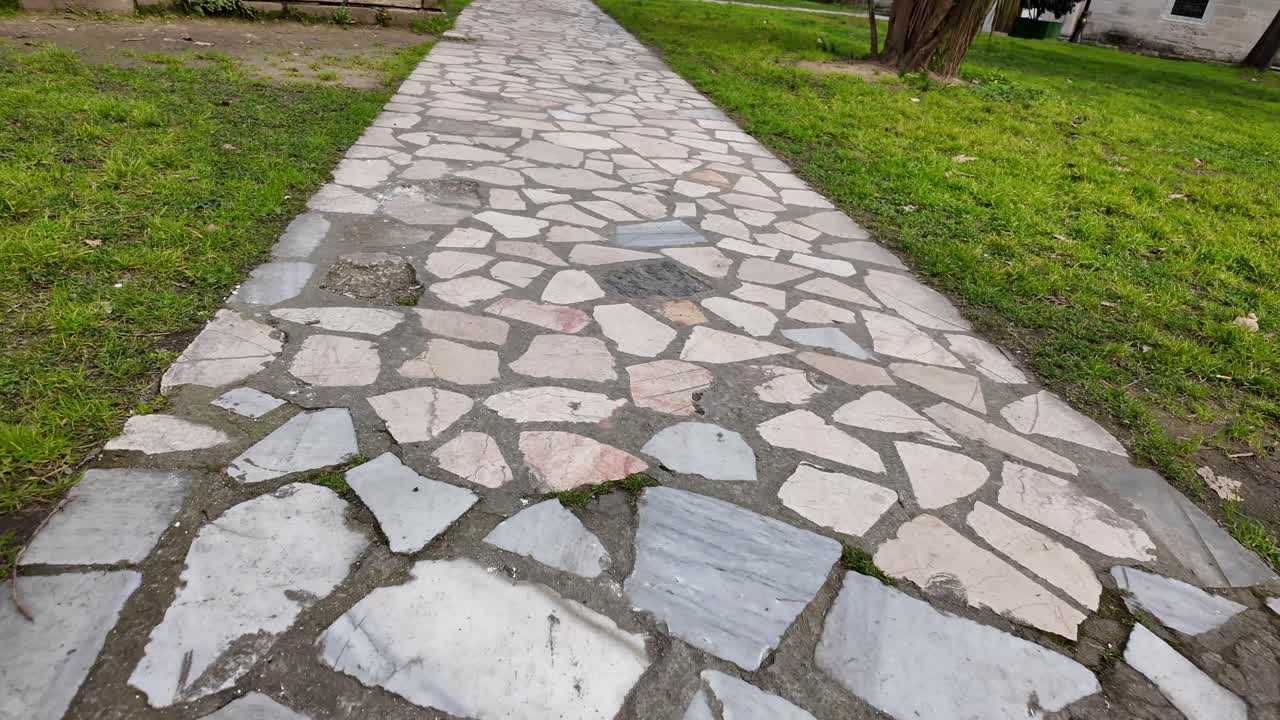 First Person View Walking on a Stone Path in a Park