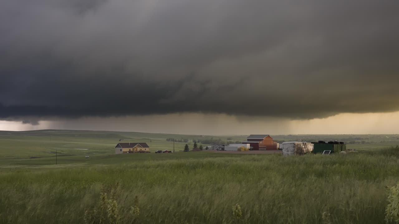 Lone Farm Houses On Rolling Green Hills Beautiful Storm Fills With Sun Set Color