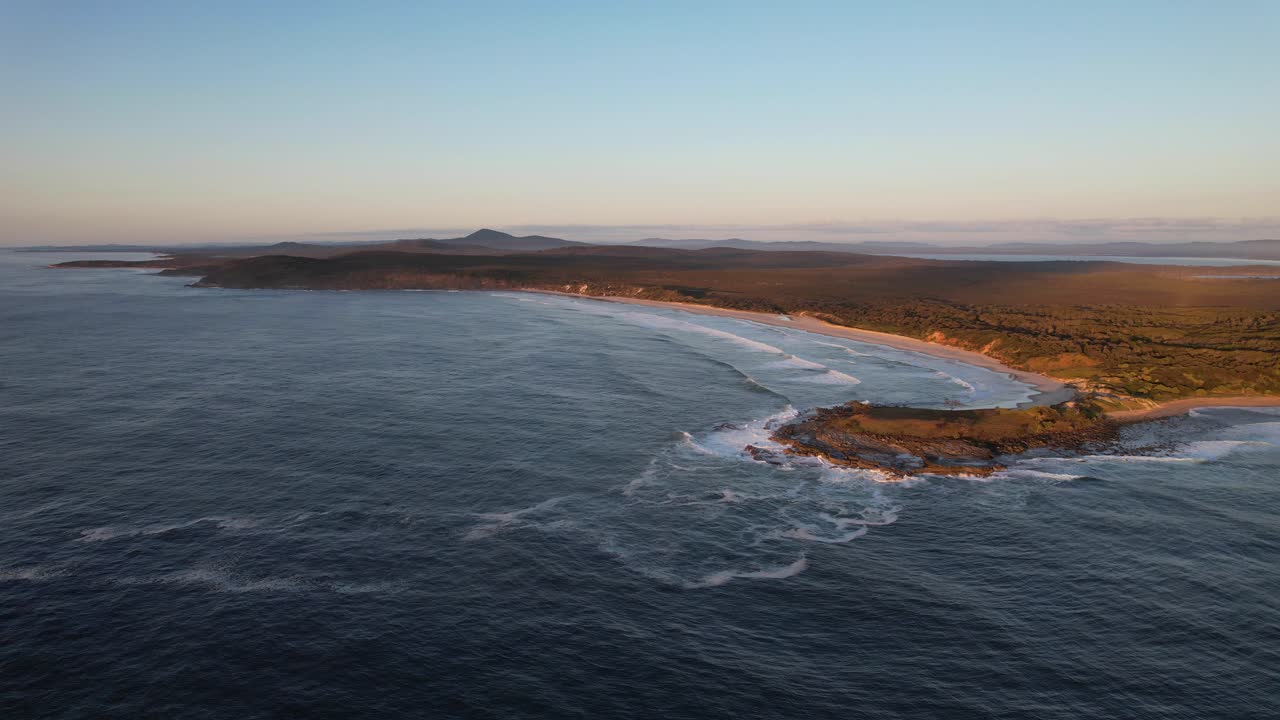 Angourie Back Beach And Angourie Point Beach At Sunset In NSW, Australia - aerial shot