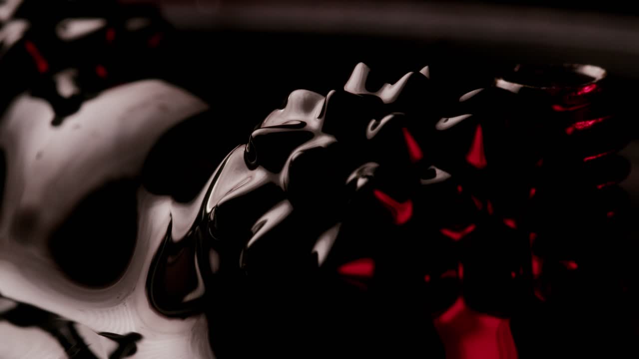 orbes negras que se mueven en fluido ferromagnético negro