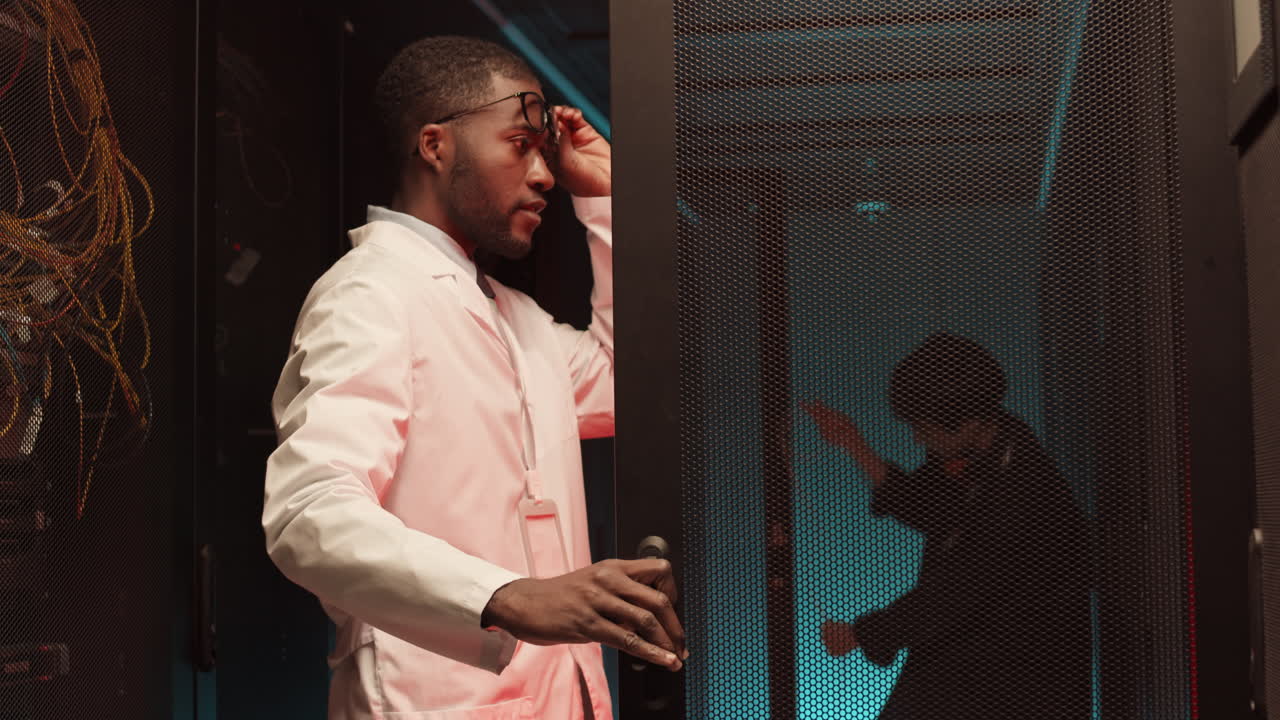 Two IT Specialists Maintaining Work of Server Room