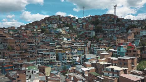 Drone-aerial-flying-over-Medellin,-Comuna-13-slums,-destination-in-Colombia,-South-america