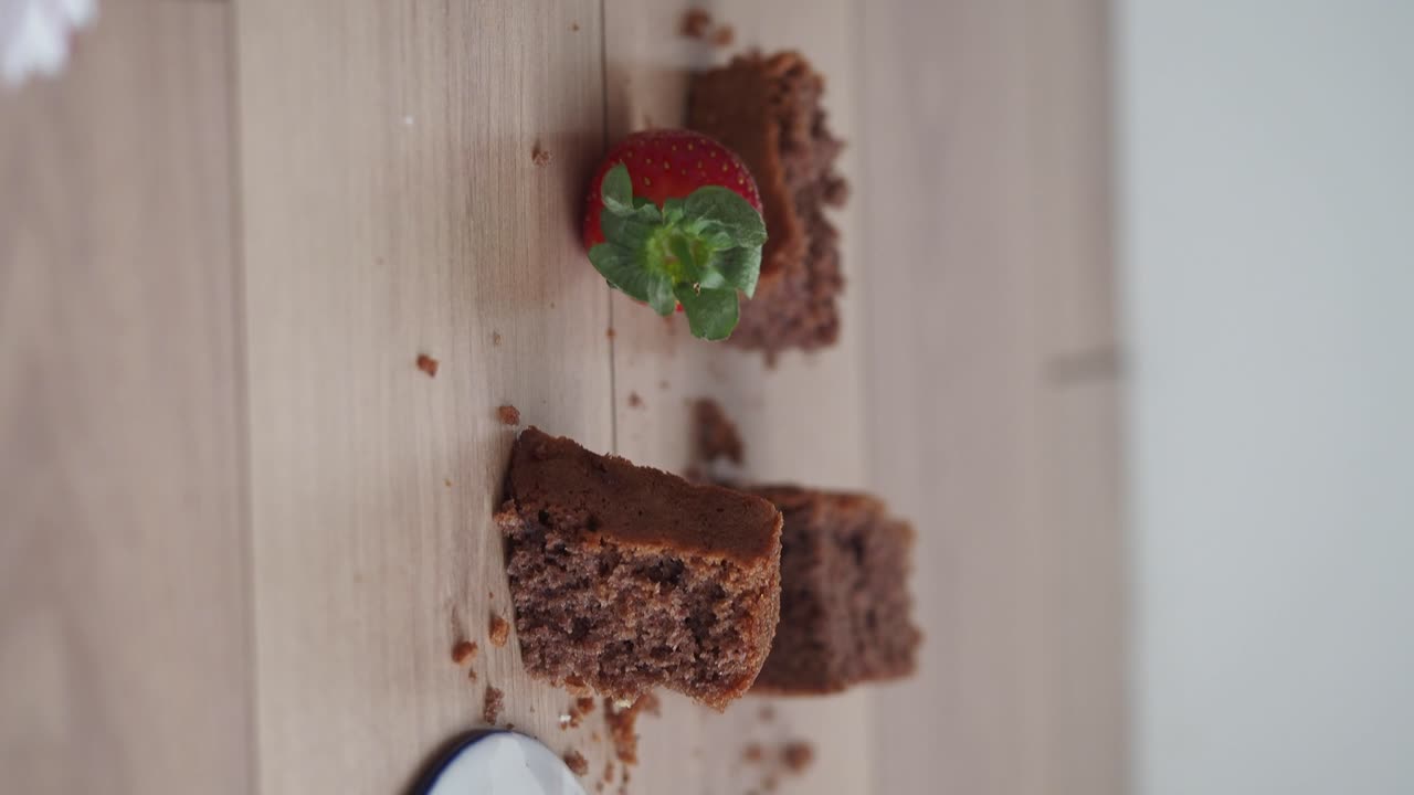 Brownies and Strawberries on Wooden Table