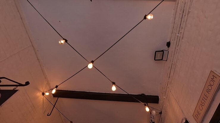 String lights illuminate a hotel ceiling
