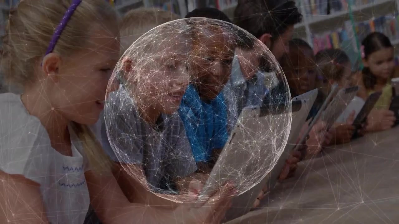 Students tapping tablets at table, starting network sphere rotating over group, aiding education