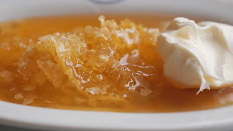 honeycomb and cream on a plate