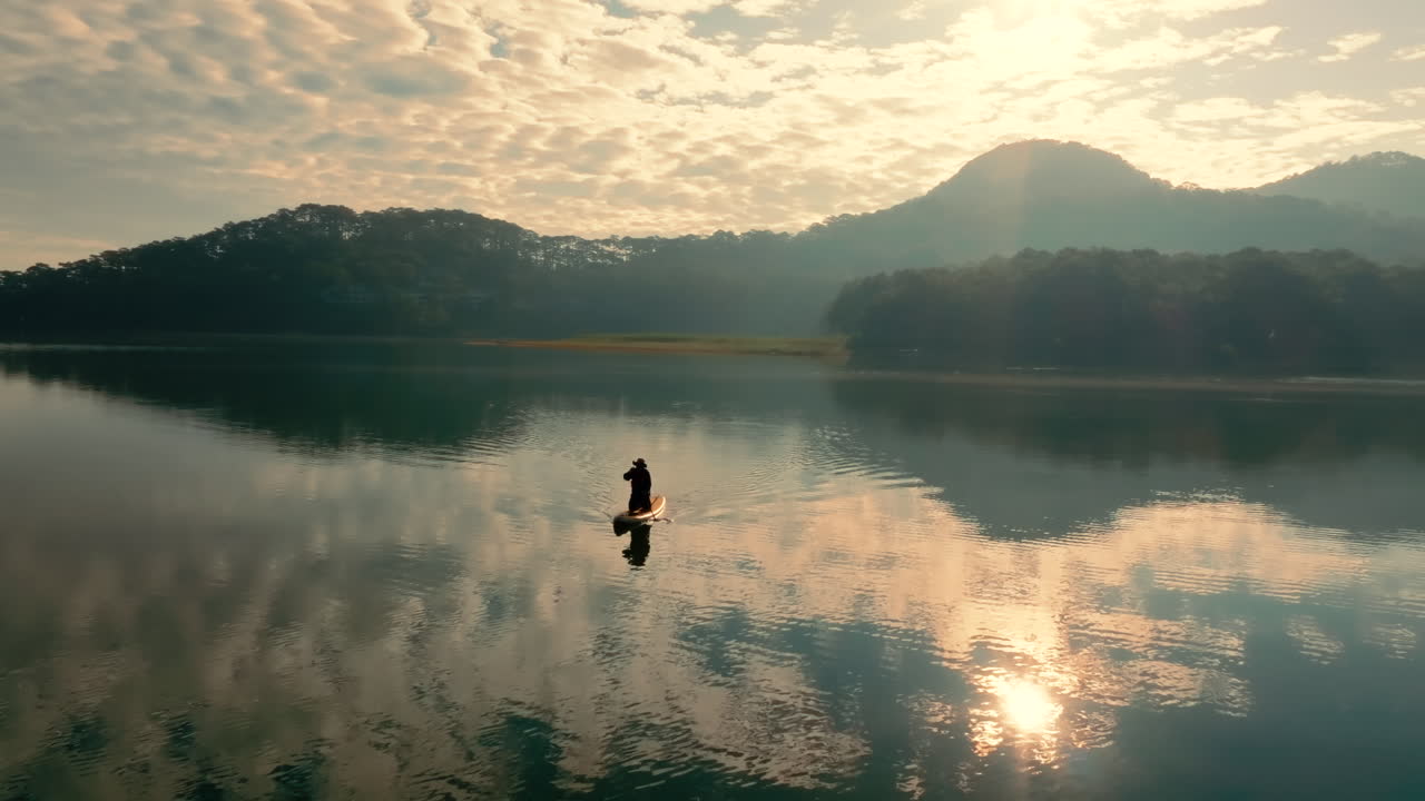 Sunrise Paddleboard on a Serene Mountain Lake