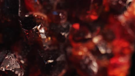 close-up details of a citrine golden quartz crystal studio-lit against a black background