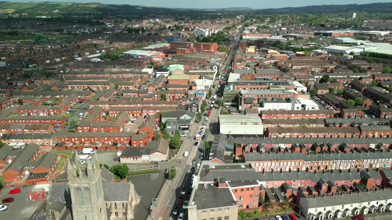 Wide descending aerial video of the Newtownards Road in East Belfast, Northern Ireland on a bright sunny day. Filmed in 4K, 60FPS and with Rec709 color.