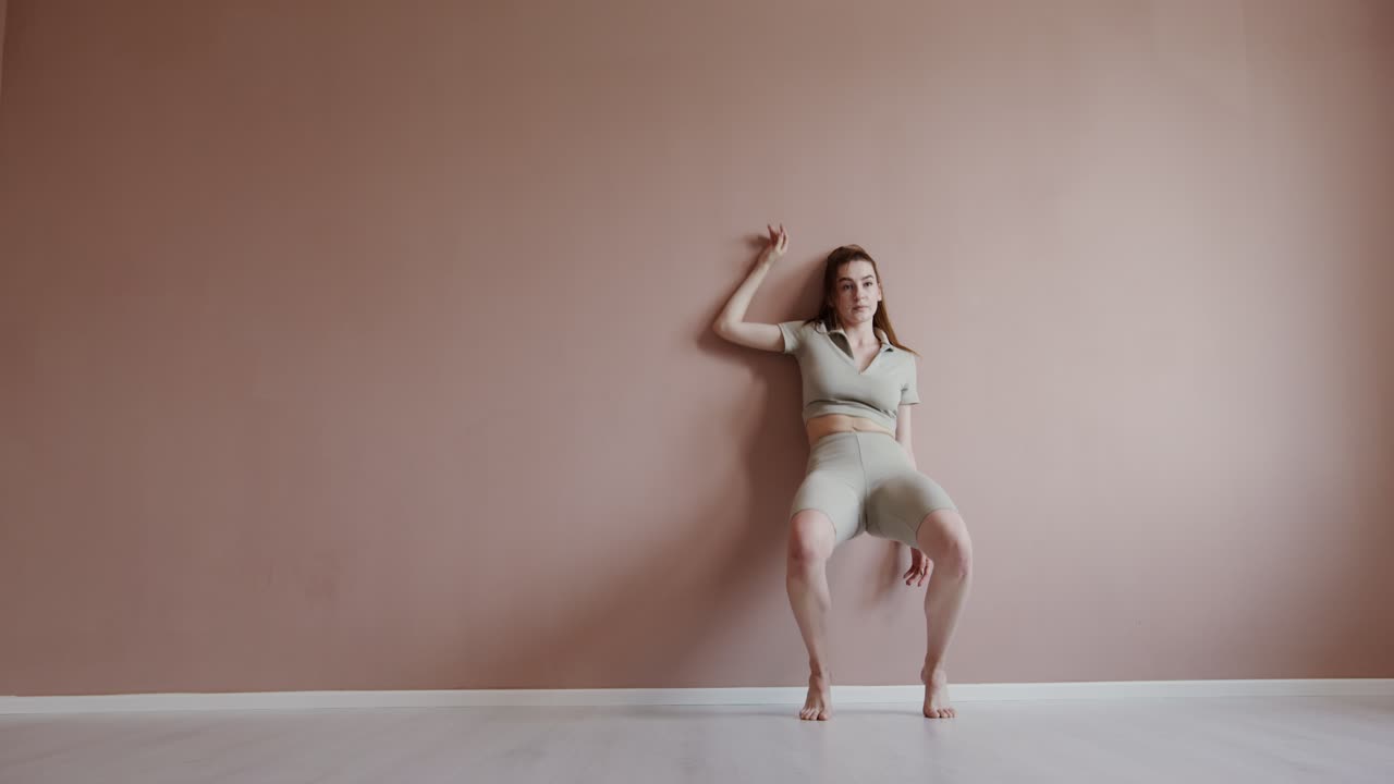 A woman dancing in a studio