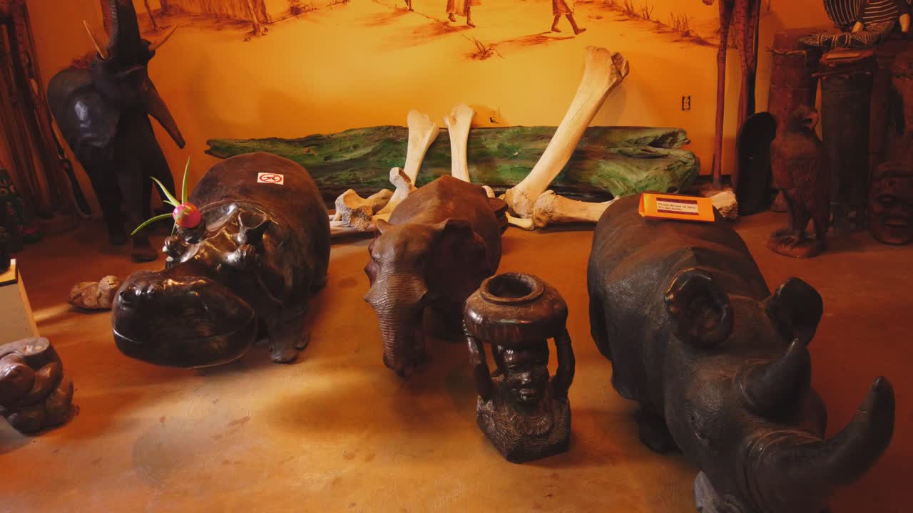Statue and carvings of animals at an Ostrich Farm