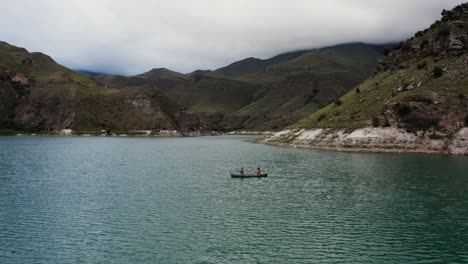 couple canoeing on a mountain lake