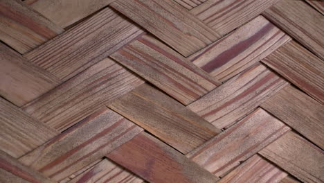 close-up of woven hinoki wood strips on the wall of a japanese bathhouse