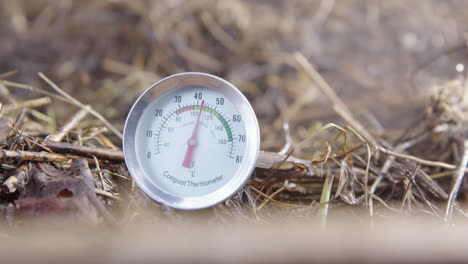 zoom in - a compost thermometer showing ideal compost temperature