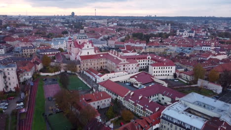 Aerial-flying-over-Vilnius-old-town-on-cloudy-day,-Lithuania