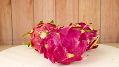 dragon fruits arranged on a wooden background