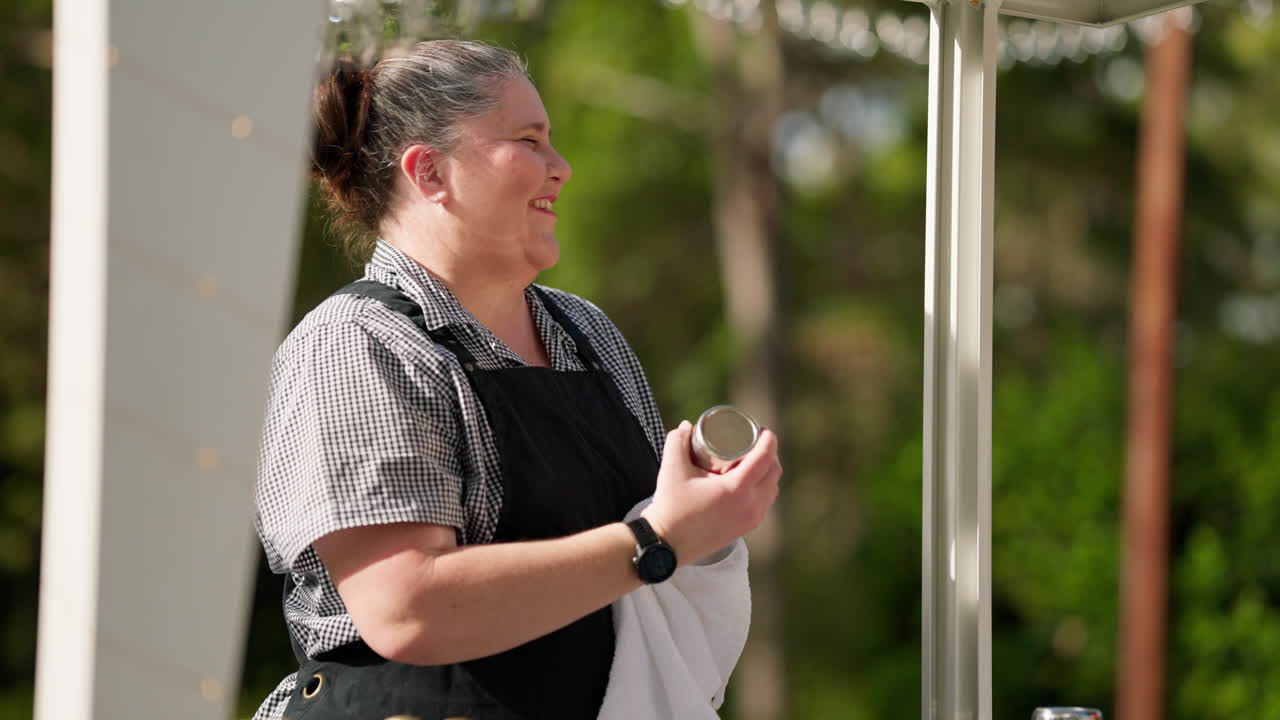 Close Up Slow Motion Smiling Laughing Brunette Bartender Wiping Cocktail Shaker, 4K Slow Motion