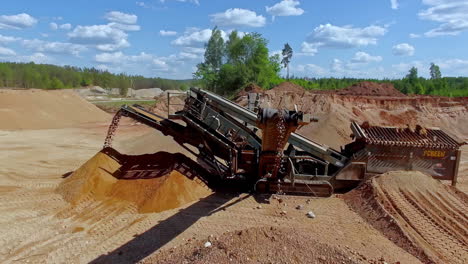 Working-excavation-line-in-gravel-quarry,-aerial-orbit-view